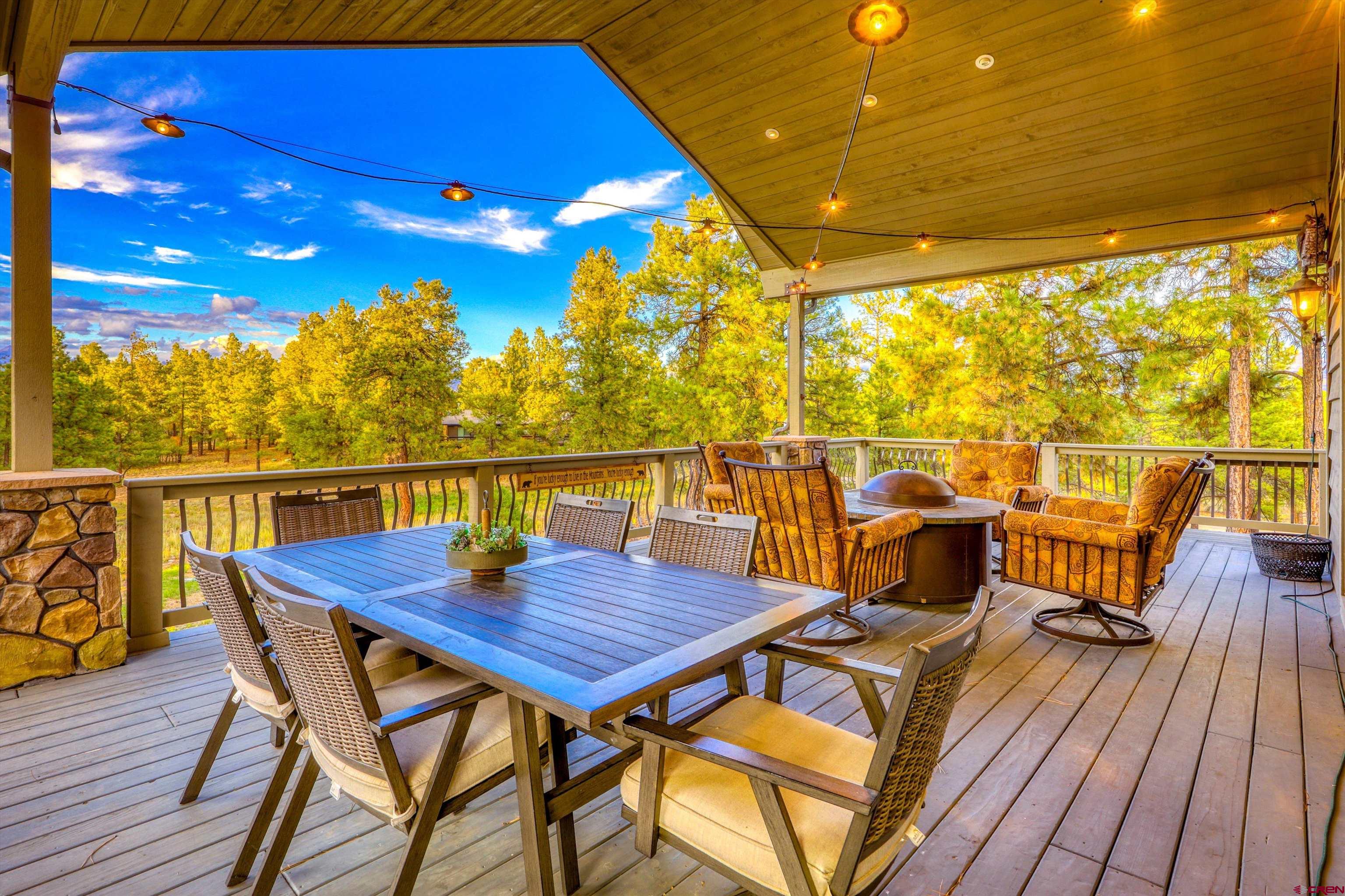 171 South Squaw Canyon Place Pagosa Springs, CO 81147 - Photo 41 of 45 a view of a balcony with wooden floor and outdoor seating