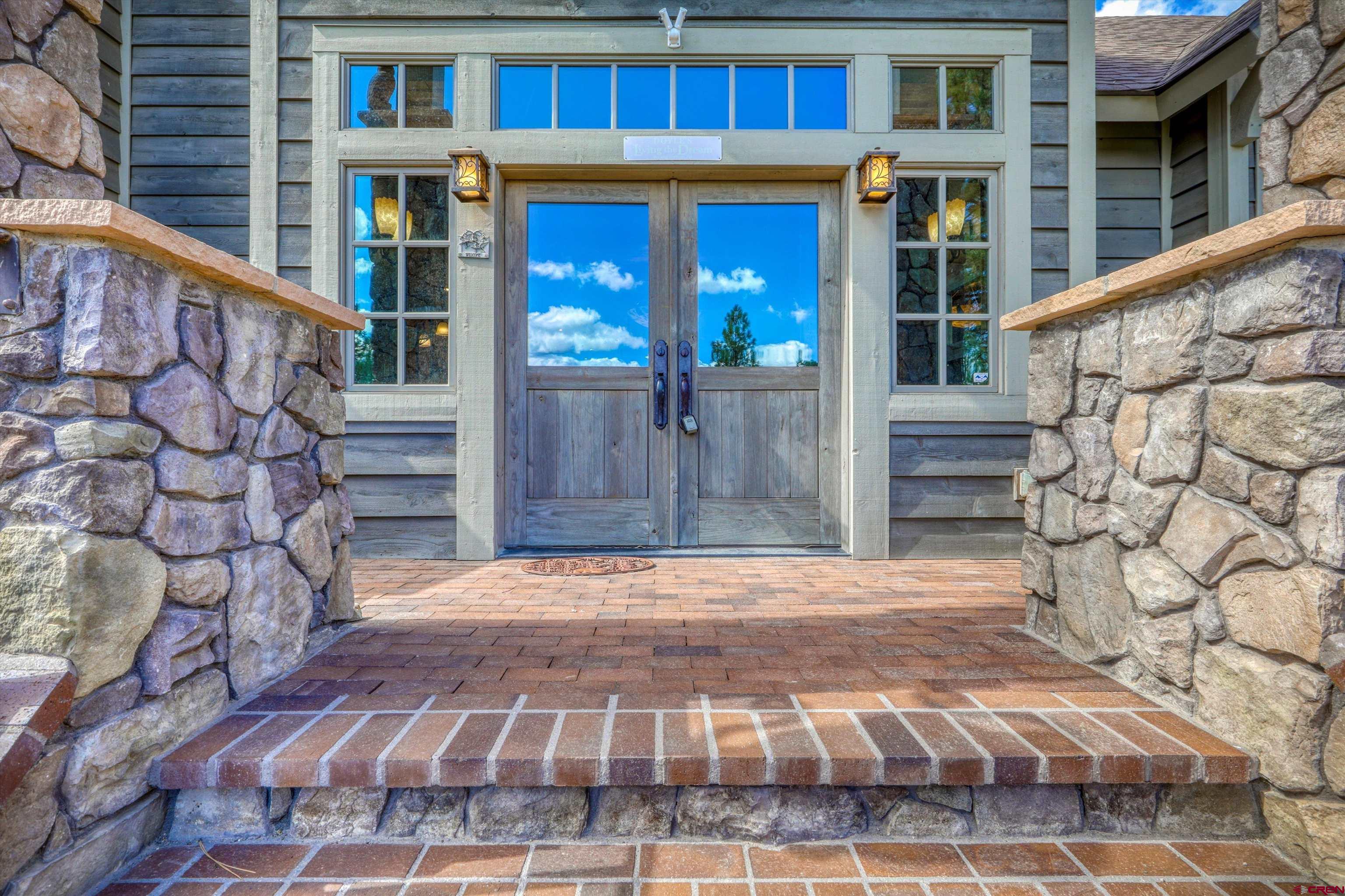 171 South Squaw Canyon Place Pagosa Springs, CO 81147 - Photo 5 of 45 a view of an entrance of the building