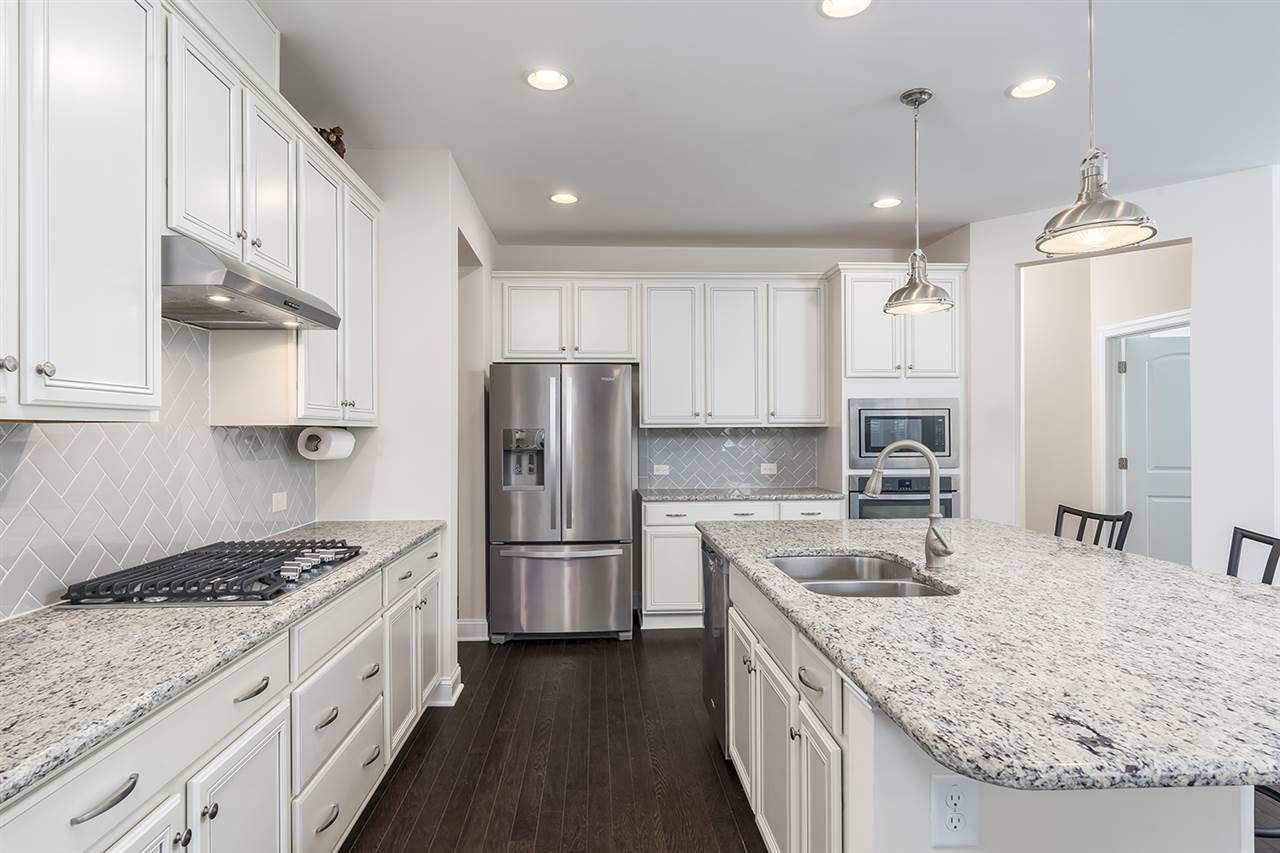 312 Morgan Ridge Road Holly Springs, NC 27540 - Photo 6 of 30 Gourmet Kitchen with Stainless Steel Appliances and Gas Cooktop
