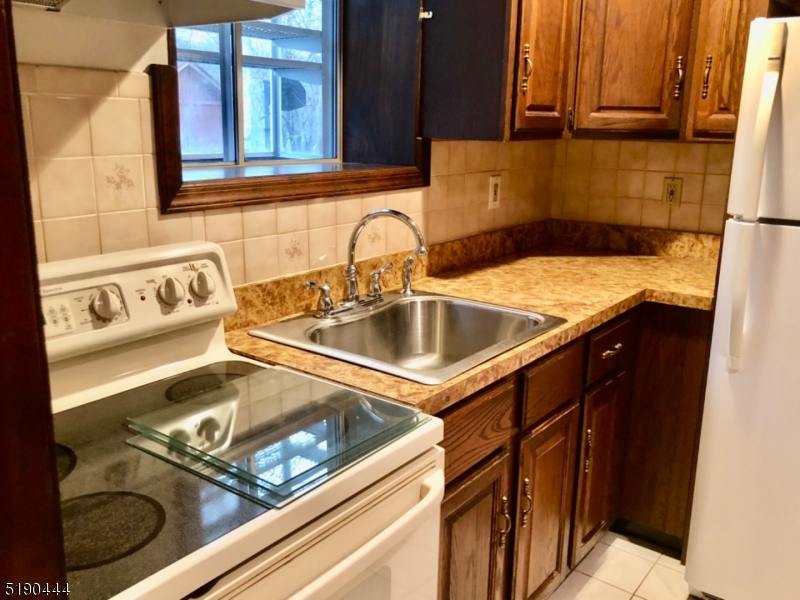 27 Old Rte 23 West Milford, NJ 07435 - Photo 12 of 14 a close view of a sink and dishwasher in a kitchen