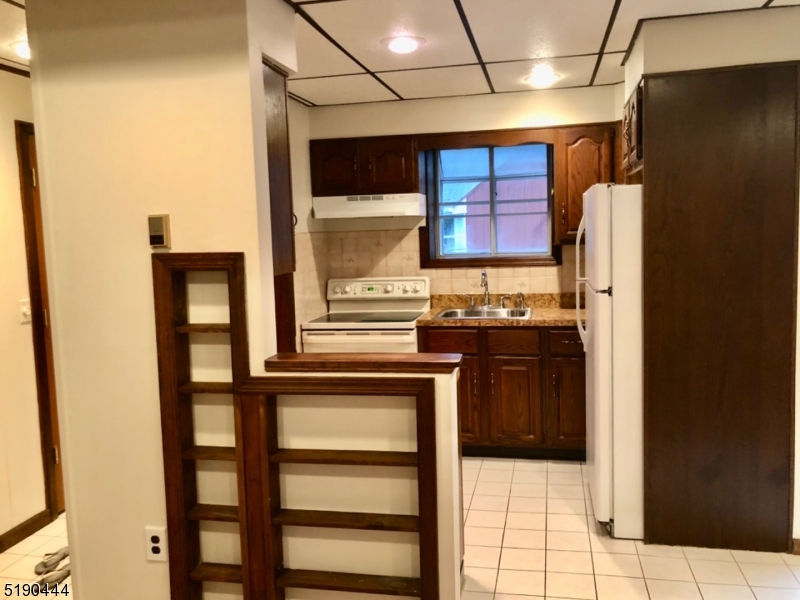 27 Old Rte 23 West Milford, NJ 07435 - Photo 3 of 14 a kitchen with stainless steel appliances granite countertop a refrigerator and a stove