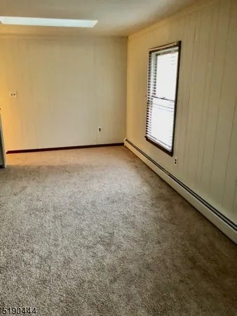 a view of a room that has a window in it