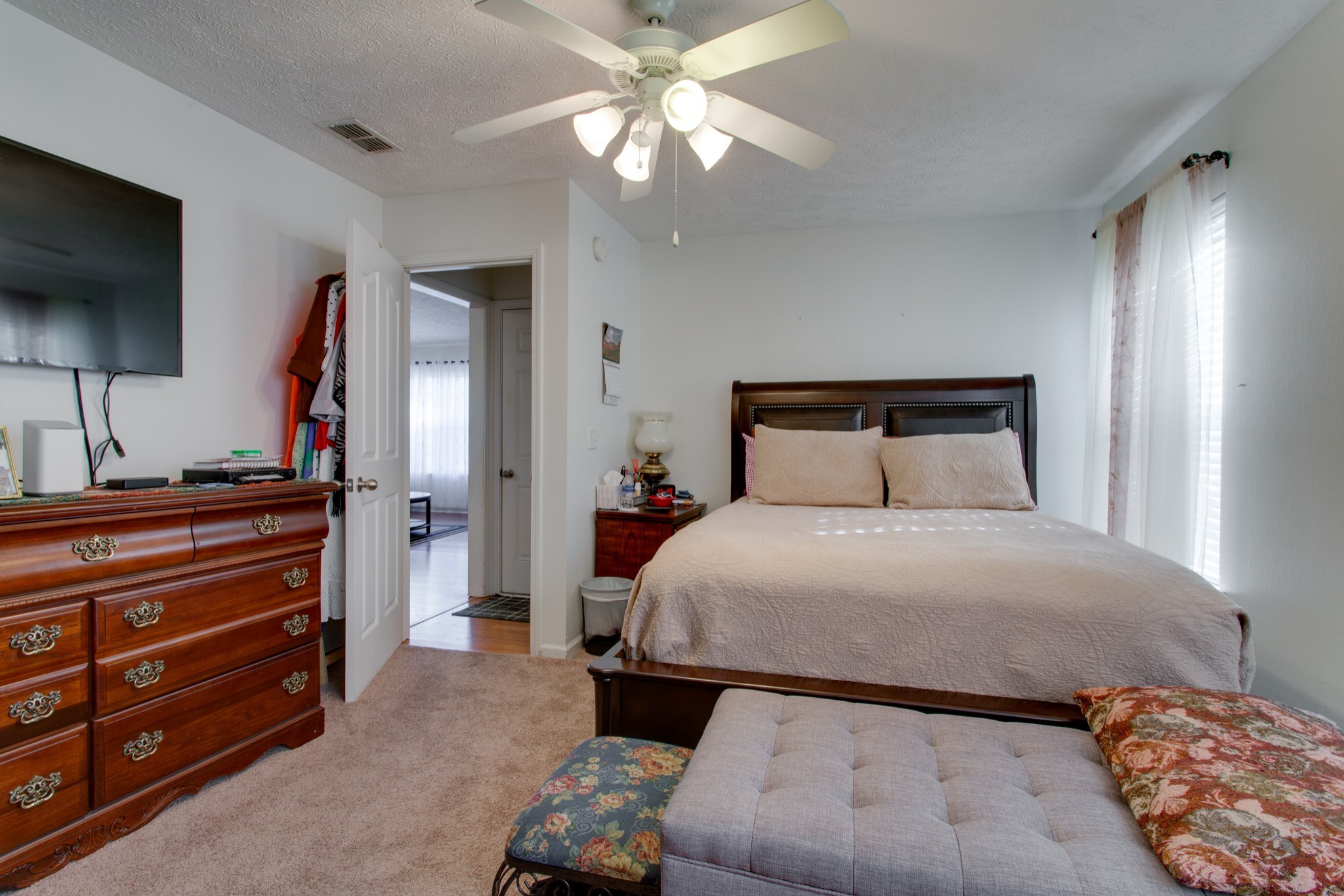 2214 Cason Trail Murfreesboro, TN 37128 - Photo 8 of 13 a bedroom with a bed and a flat screen tv