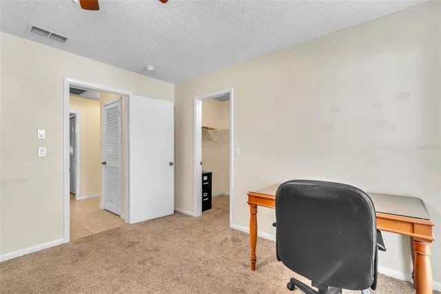 a workspace with furniture and closet