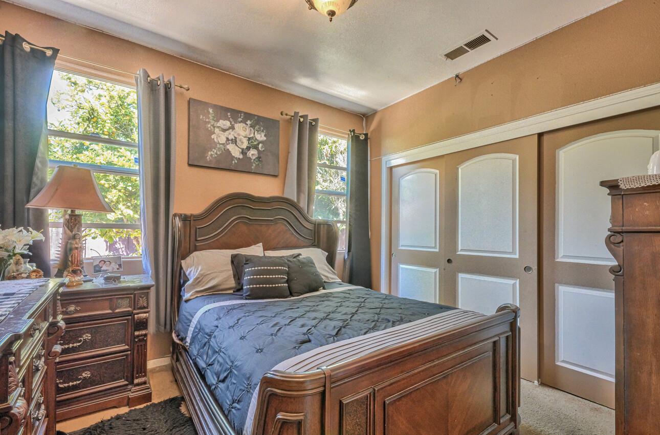 1013 Capri Way Salinas, CA 93905 - Photo 14 of 23 a bedroom with a bed and large window