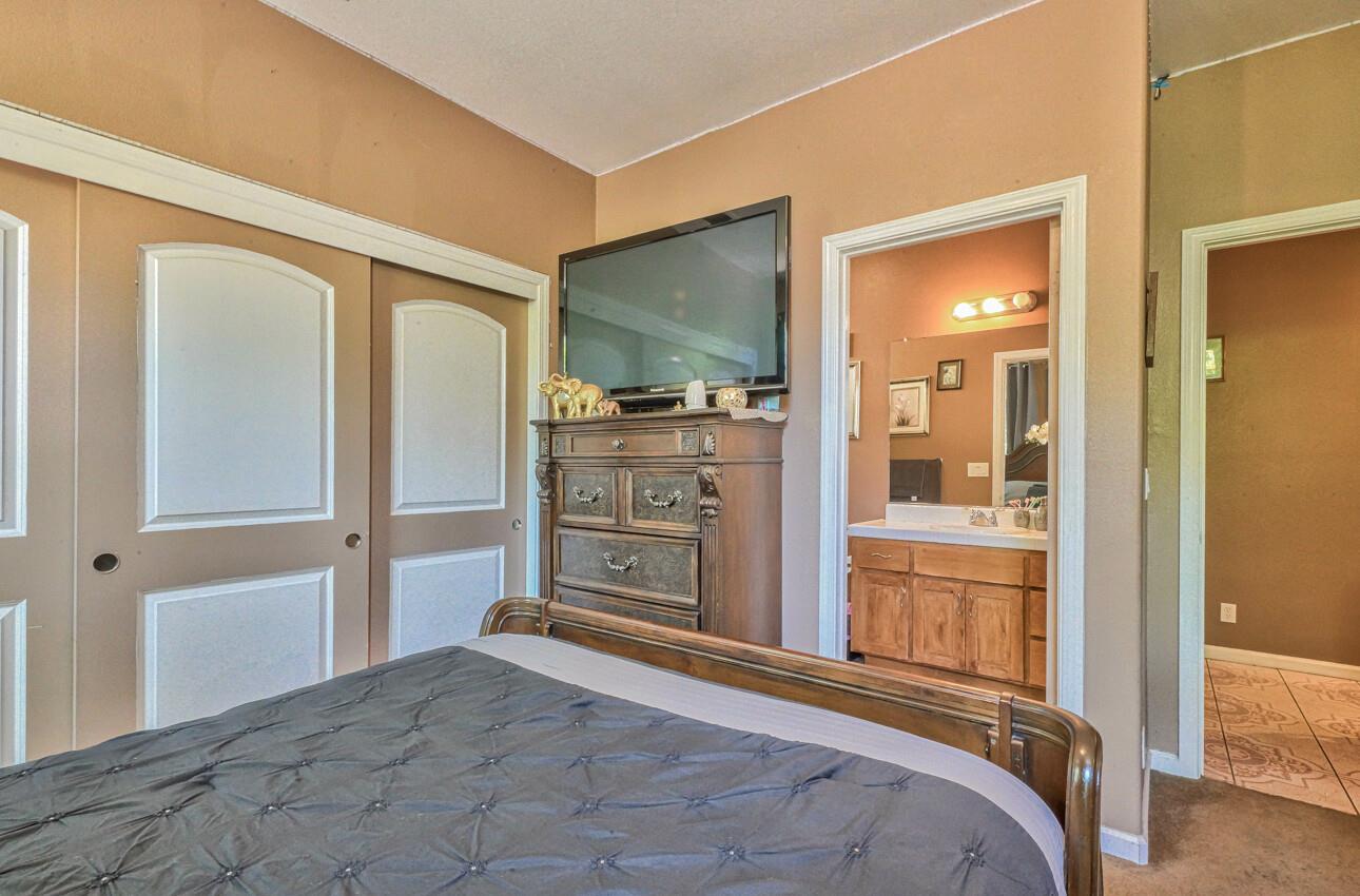 1013 Capri Way Salinas, CA 93905 - Photo 15 of 23 a bedroom with a bed and a television