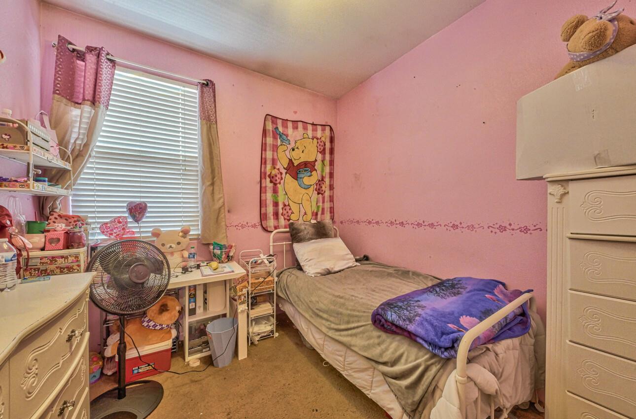 1013 Capri Way Salinas, CA 93905 - Photo 17 of 23 a bedroom with a bed and a table