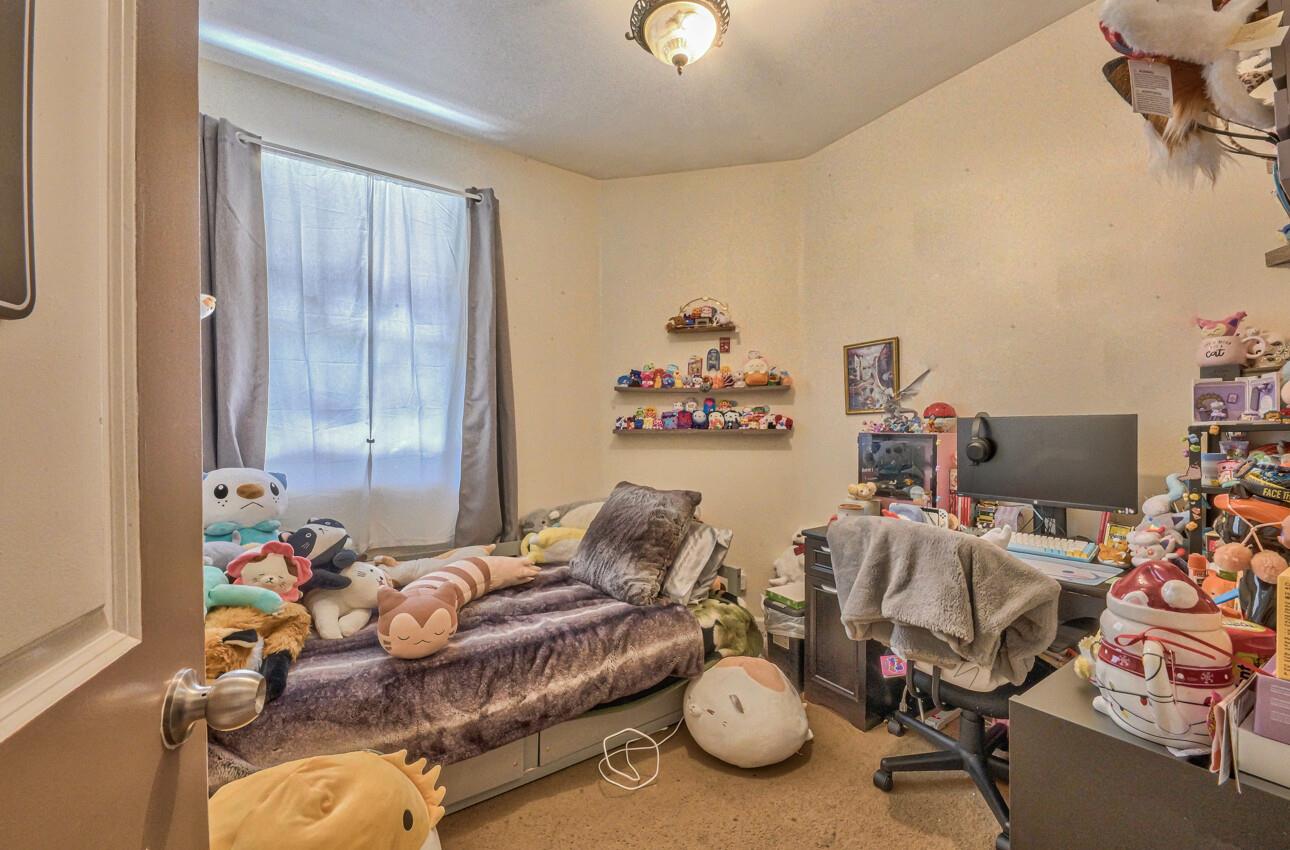 1013 Capri Way Salinas, CA 93905 - Photo 18 of 23 a room with furniture and a wooden floor