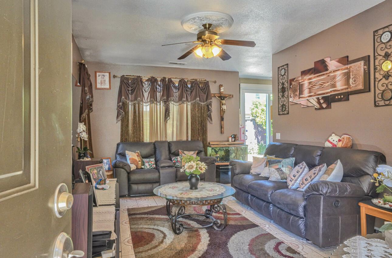 1013 Capri Way Salinas, CA 93905 - Photo 4 of 23 a living room with furniture and a large window