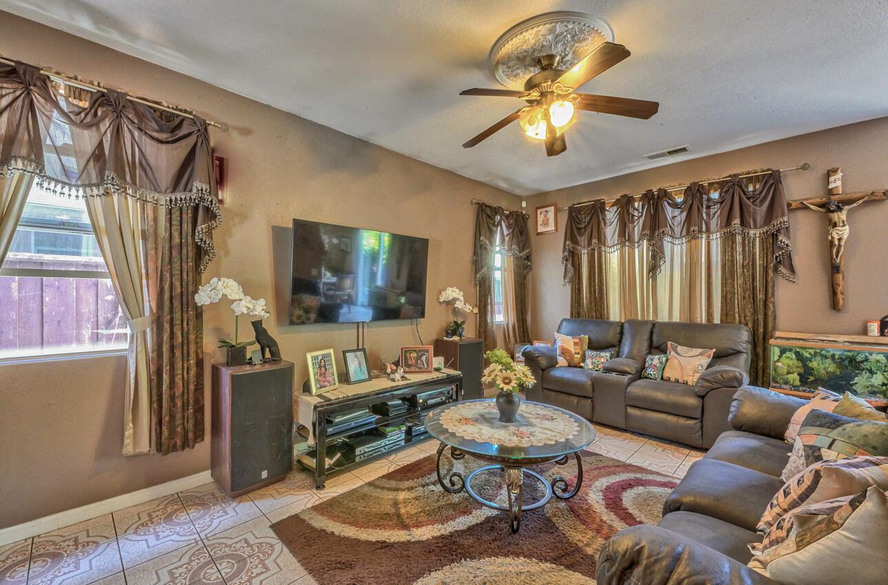 1013 Capri Way Salinas, CA 93905 - Photo 5 of 23 a living room with furniture and a chandelier