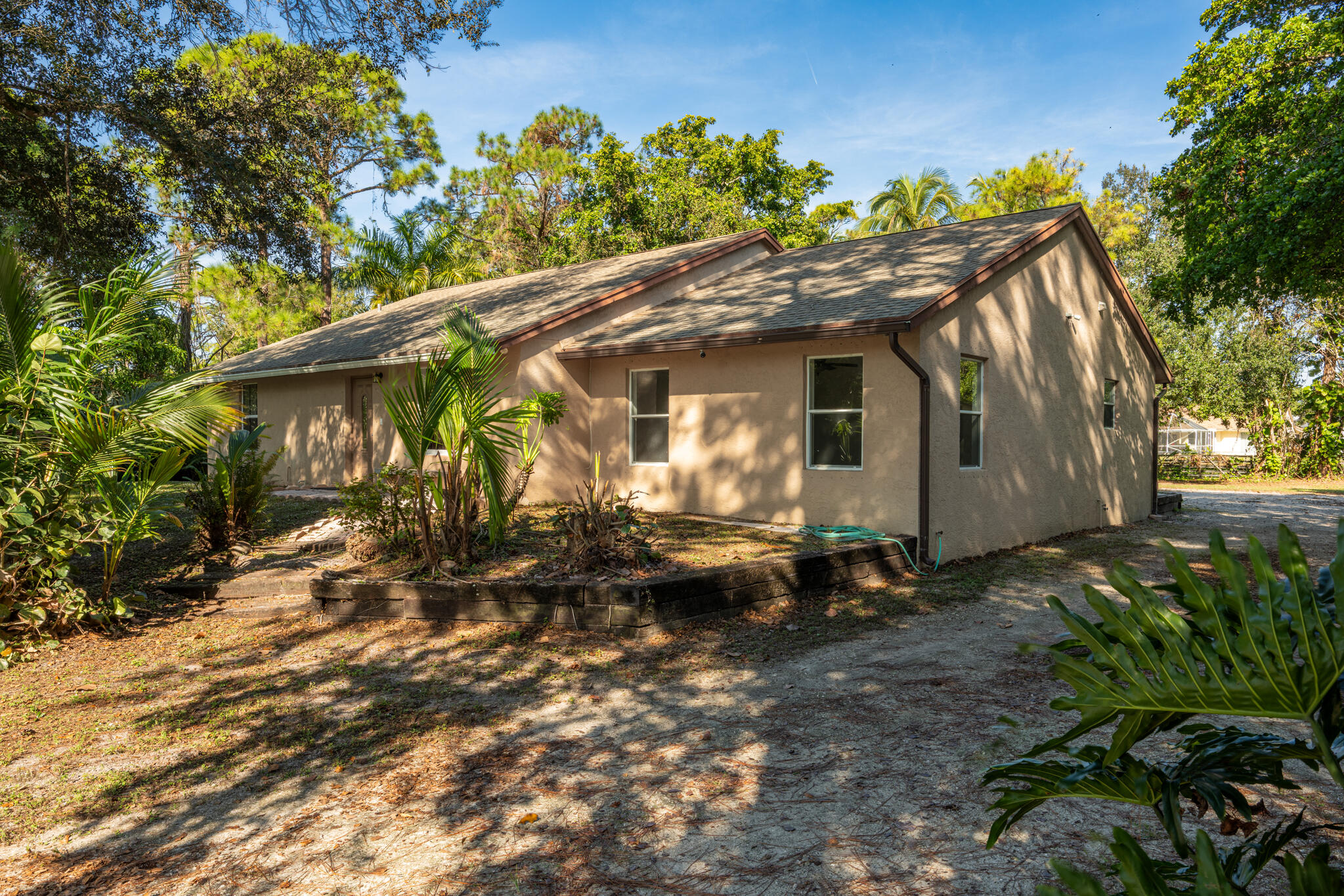 17889 62nd Road North The Acreage, FL 33470 - Photo 4 of 32 a backyard of a house with lots of green space