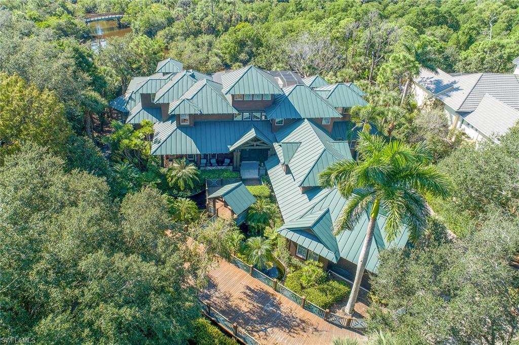 1205 Pocantico Lane Naples, FL 34110 - Photo 1 of 35 an aerial view of a house