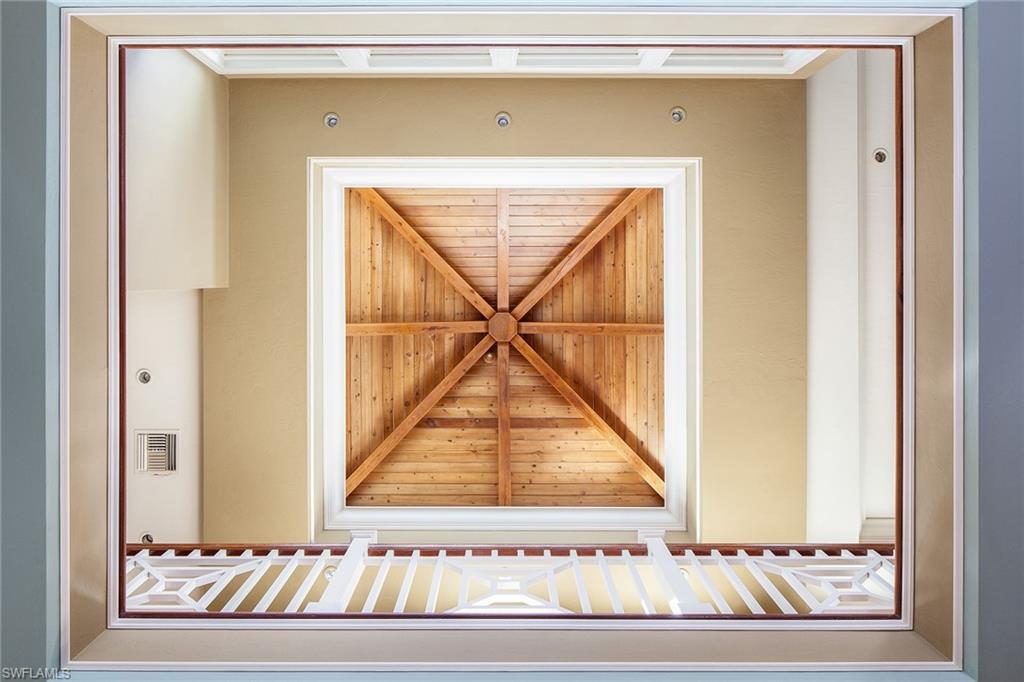 1205 Pocantico Lane Naples, FL 34110 - Photo 12 of 35 a view of a door with a door and a potted plant