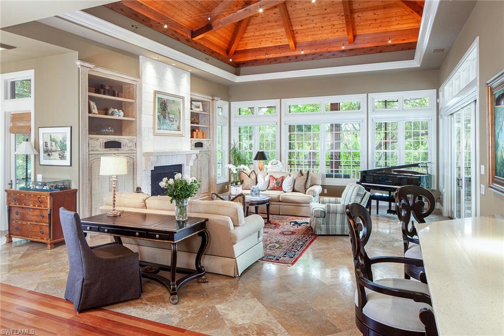 1205 Pocantico Lane Naples, FL 34110 - Photo 13 of 35 a living room with furniture and a large window