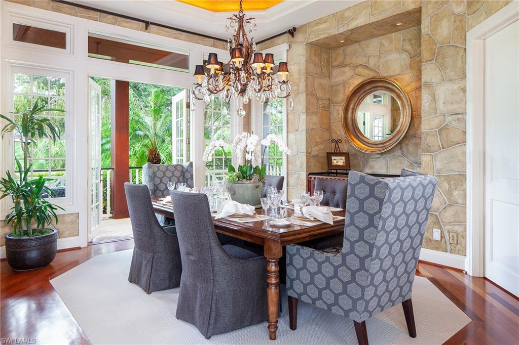 1205 Pocantico Lane Naples, FL 34110 - Photo 14 of 35 a view of a dining room with furniture window and outside view