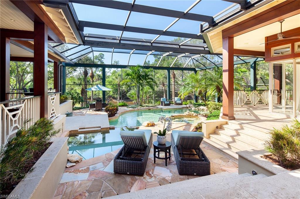 1205 Pocantico Lane Naples, FL 34110 - Photo 19 of 35 a patio with yard table and chairs