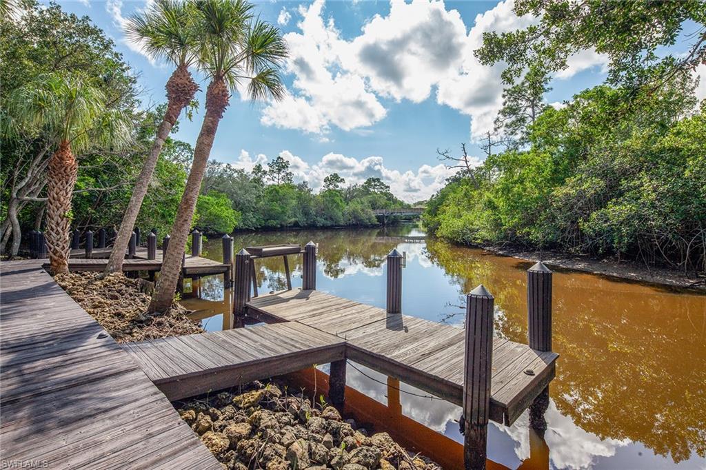 1205 Pocantico Lane Naples, FL 34110 - Photo 21 of 35 a view of a wooden deck with furniture