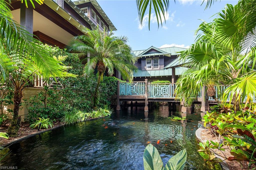 1205 Pocantico Lane Naples, FL 34110 - Photo 4 of 35 a view of a backyard with plants and a patio