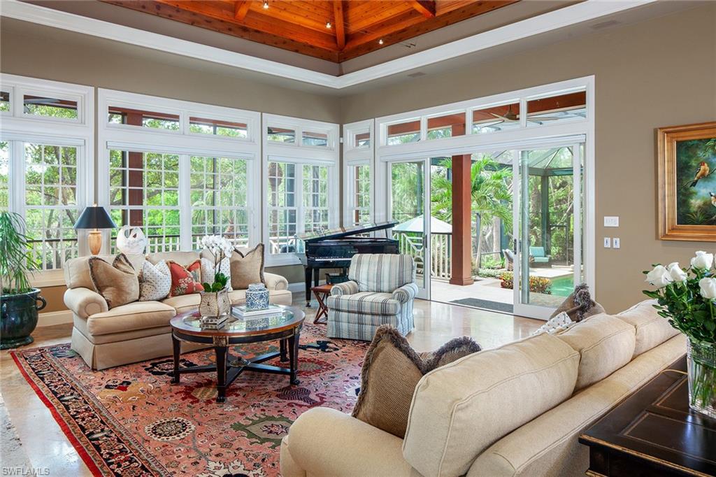 1205 Pocantico Lane Naples, FL 34110 - Photo 8 of 35 a living room with furniture and a large window
