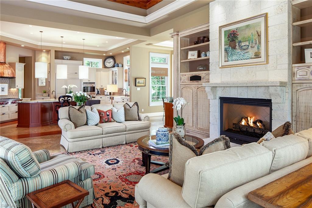 1205 Pocantico Lane Naples, FL 34110 - Photo 10 of 35 a living room with furniture fireplace and a large window