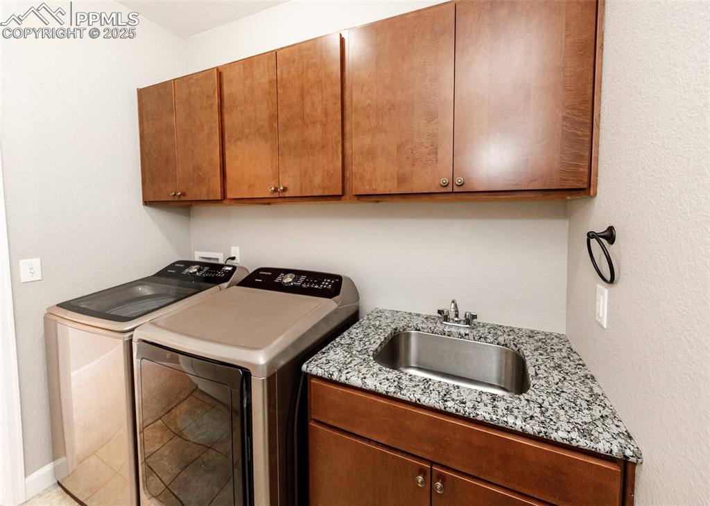 2105 Slocum Road Peyton, CO 80831 - Photo 15 of 27 a kitchen with a sink cabinets and utility