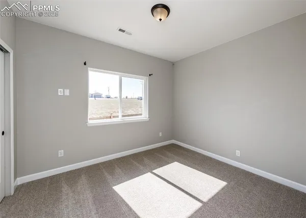 a large white kitchen with a sink and cabinets