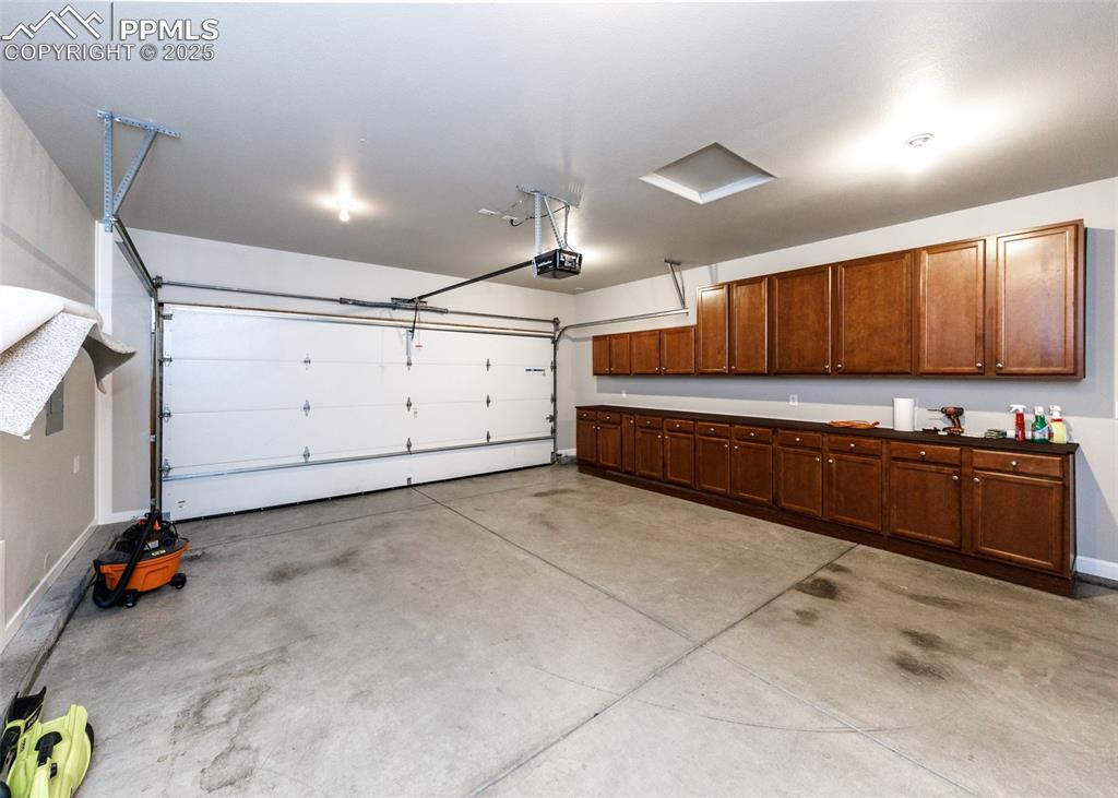 2105 Slocum Road Peyton, CO 80831 - Photo 24 of 27 a large white kitchen with a sink and cabinets