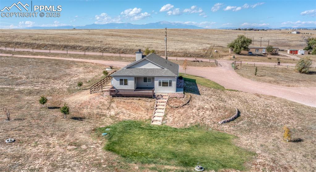 2105 Slocum Road Peyton, CO 80831 - Photo 25 of 27 a front view of a house with a yard