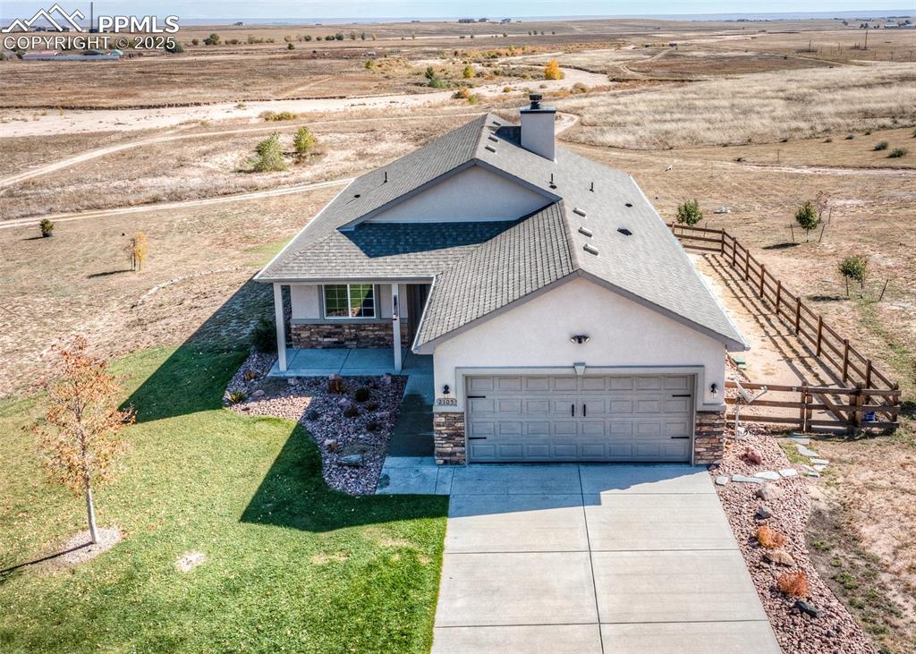 2105 Slocum Road Peyton, CO 80831 - Photo 26 of 27 a view of a house with outdoor space and ocean view