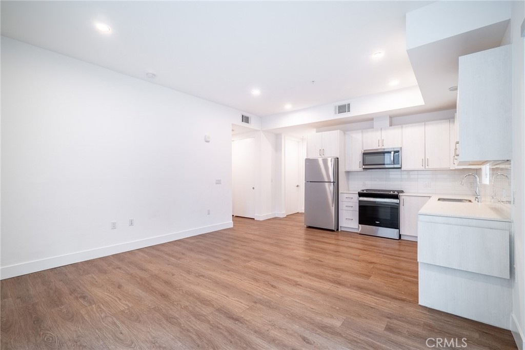 709 East Walnut, Unit 219 Pasadena, CA 91109 - Photo 12 of 38 a view of a kitchen with a sink and stainless steel appliances