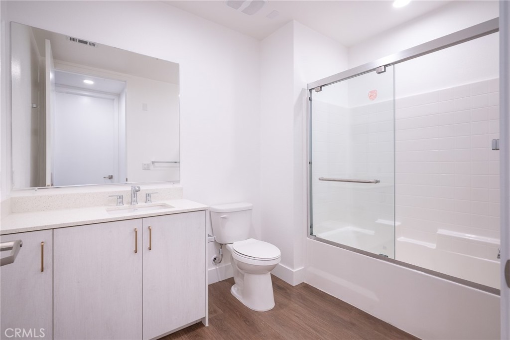 709 East Walnut, Unit 219 Pasadena, CA 91109 - Photo 14 of 38 a bathroom with a sink a toilet and shower