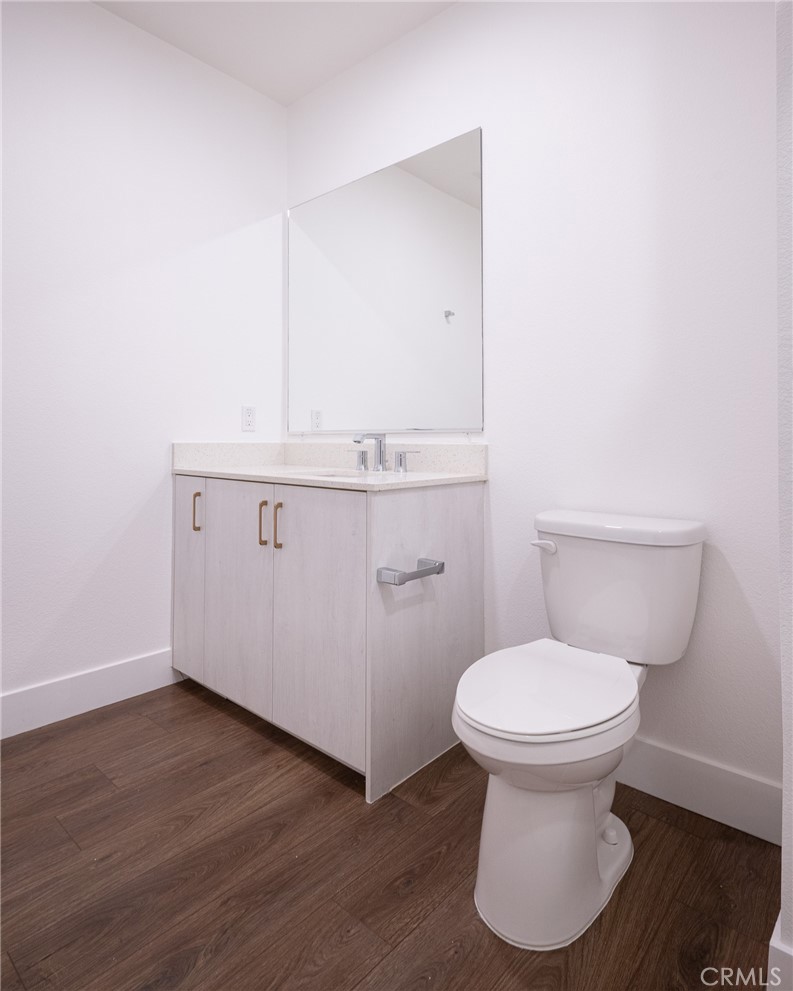 709 East Walnut, Unit 219 Pasadena, CA 91109 - Photo 20 of 38 a bathroom with a sink and a toilet