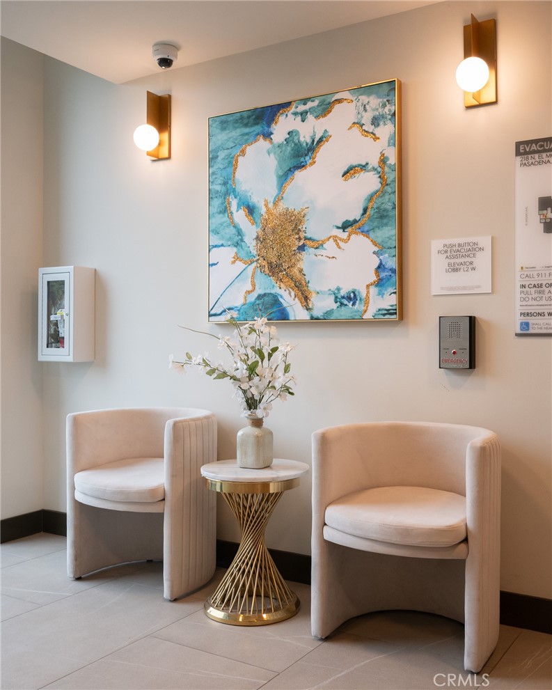 709 East Walnut, Unit 219 Pasadena, CA 91109 - Photo 22 of 38 a living room with furniture and a painting