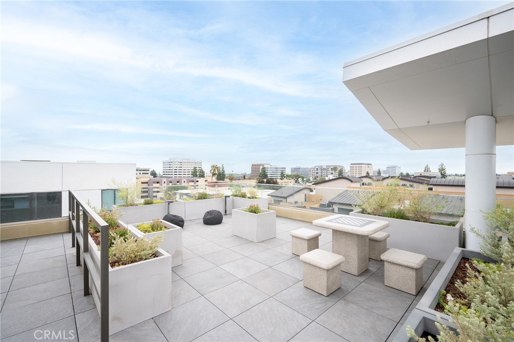 709 East Walnut, Unit 219 Pasadena, CA 91109 - Photo 23 of 38 a view of a terrace with furniture and stove
