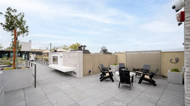 a view of a terrace with chairs and couches