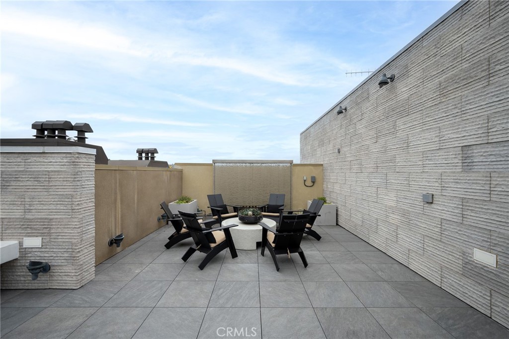 709 East Walnut, Unit 219 Pasadena, CA 91109 - Photo 27 of 38 a terrace with outdoor seating and city view