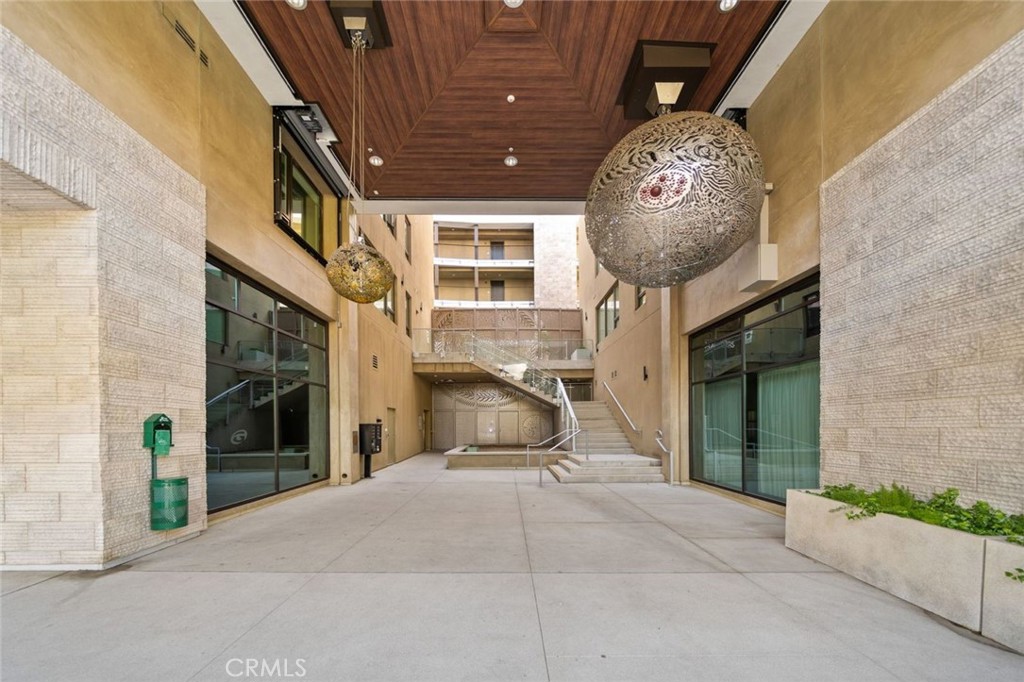 709 East Walnut, Unit 219 Pasadena, CA 91109 - Photo 3 of 38 a front view of a house with garden