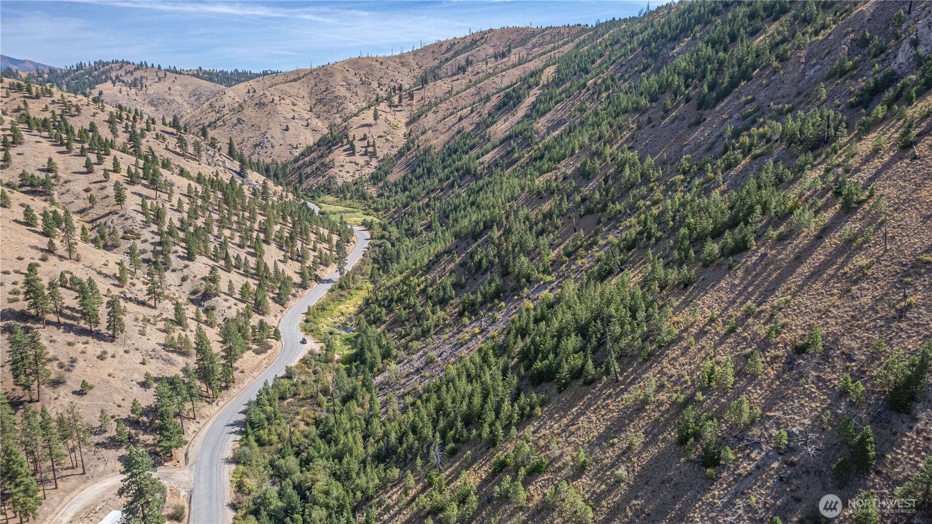 10558 Mud Creek Road Entiat, WA 98822 - Photo 23 of 23 a view of a large building with a mountain