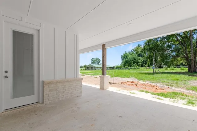 a view of a garden with an outdoor space