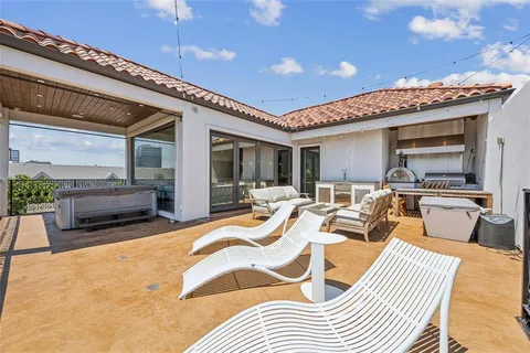 a bedroom with furniture and a large window