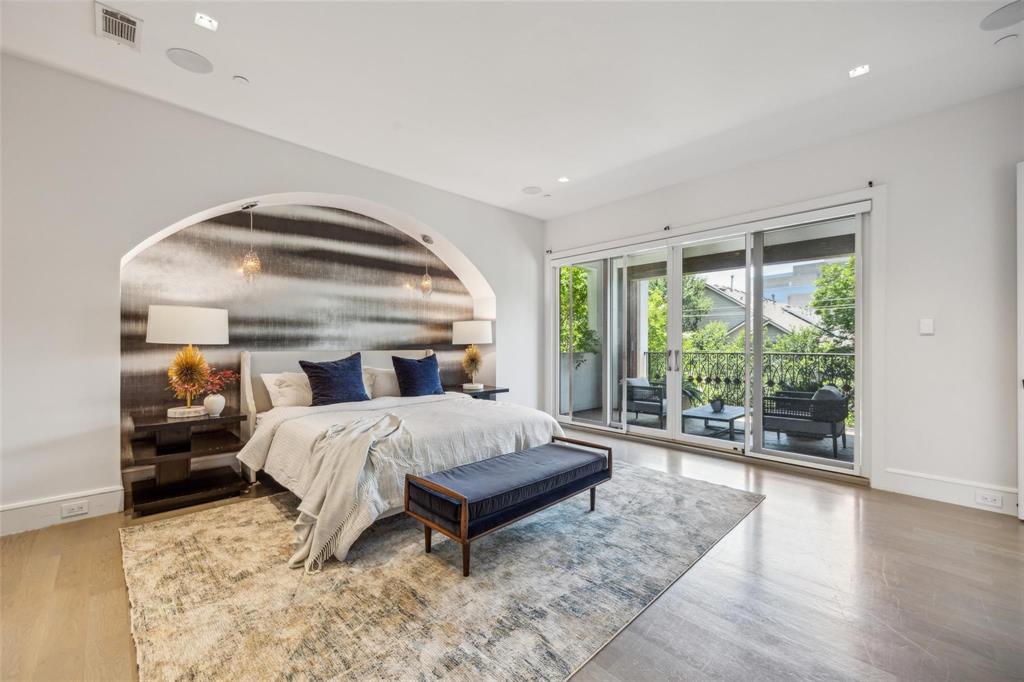 2210 Boll Street Dallas, TX 75204 - Photo 9 of 30 a bedroom with a bed and large window