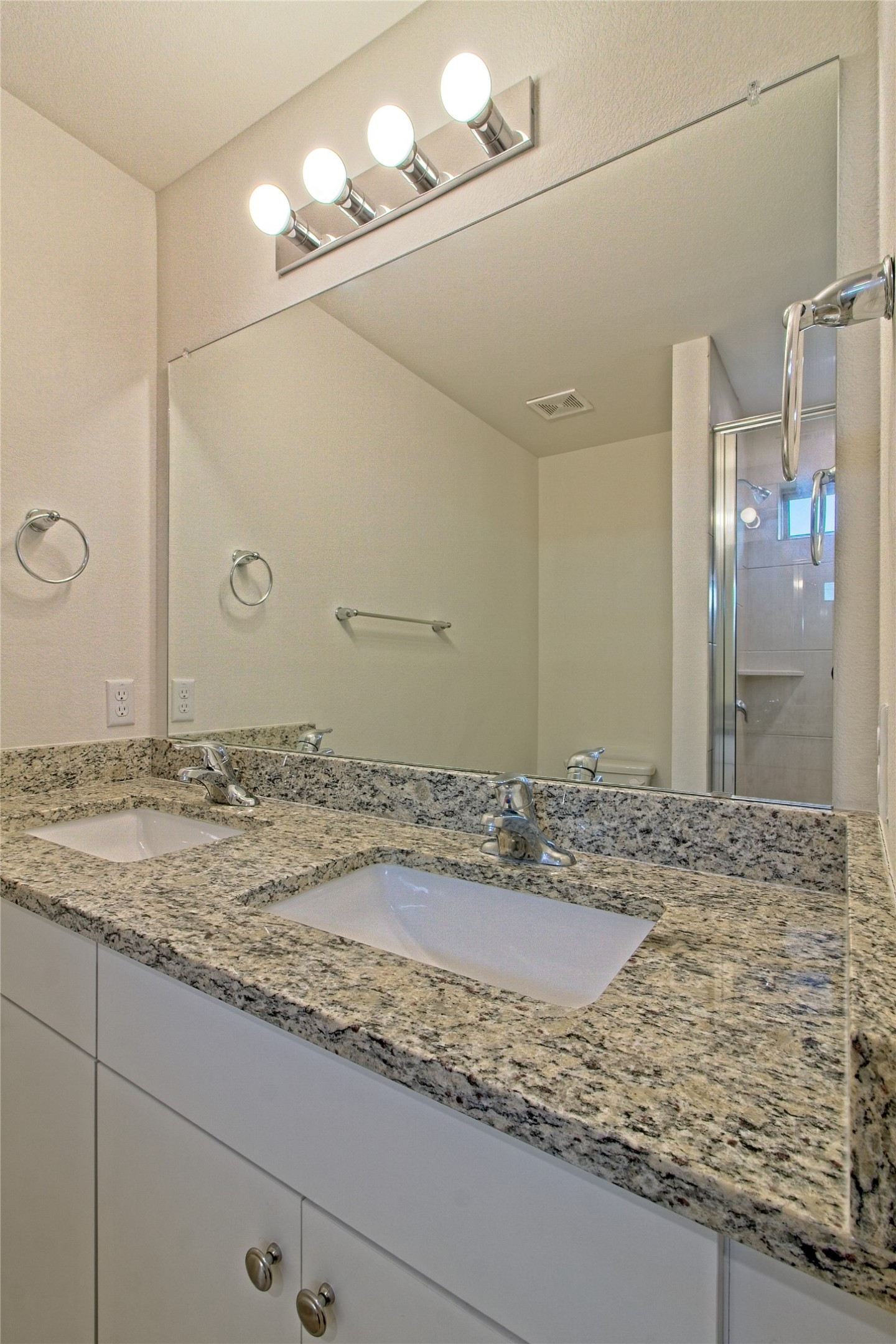 555 White Steppe Way Georgetown, TX 78626 - Photo 22 of 40 a bathroom with a granite countertop sink and a mirror