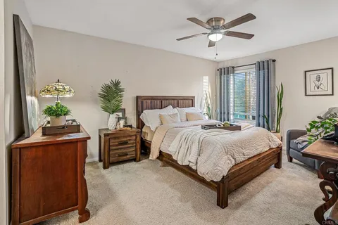 a bed room with furniture and a chandelier