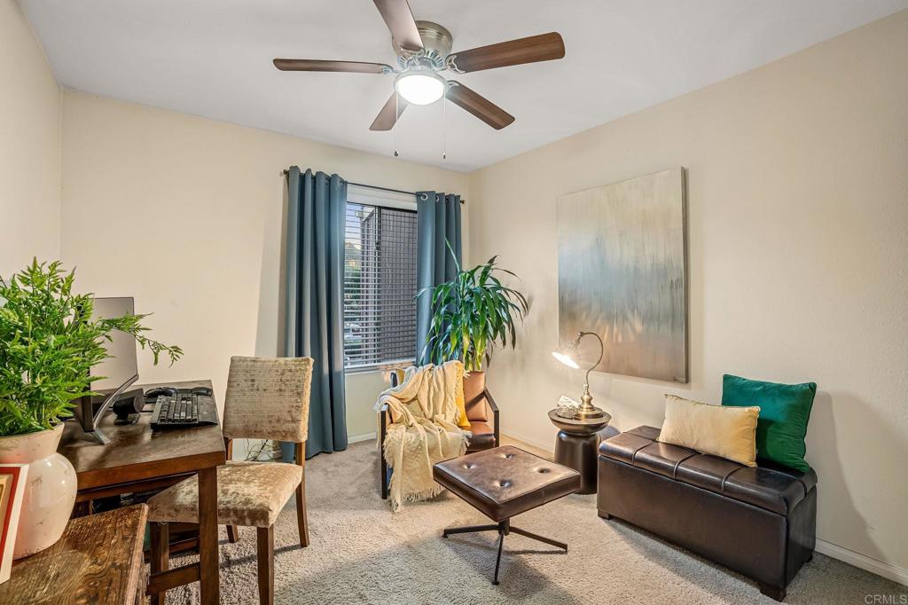 5922 Rancho Mission Road, Unit 78 San Diego, CA 92108 - Photo 20 of 25 a living room with furniture and a large window