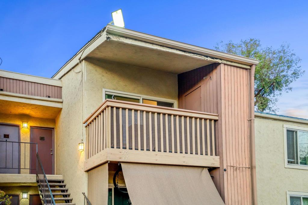 5922 Rancho Mission Road, Unit 78 San Diego, CA 92108 - Photo 2 of 25 a view of a house with a balcony