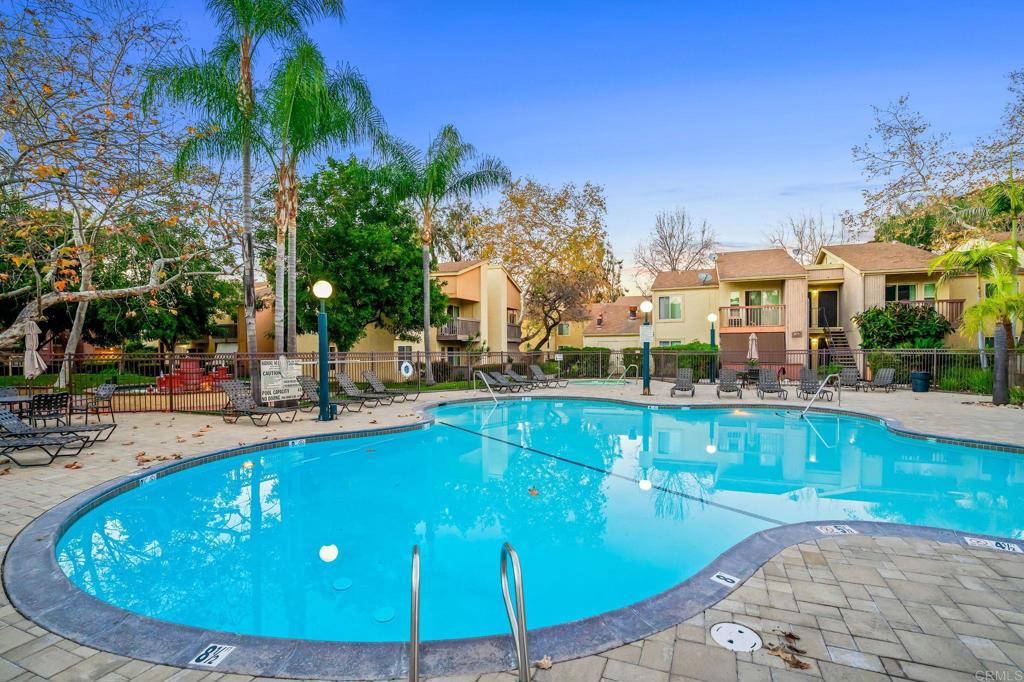 5922 Rancho Mission Road, Unit 78 San Diego, CA 92108 - Photo 23 of 25 a view of a swimming pool with a patio