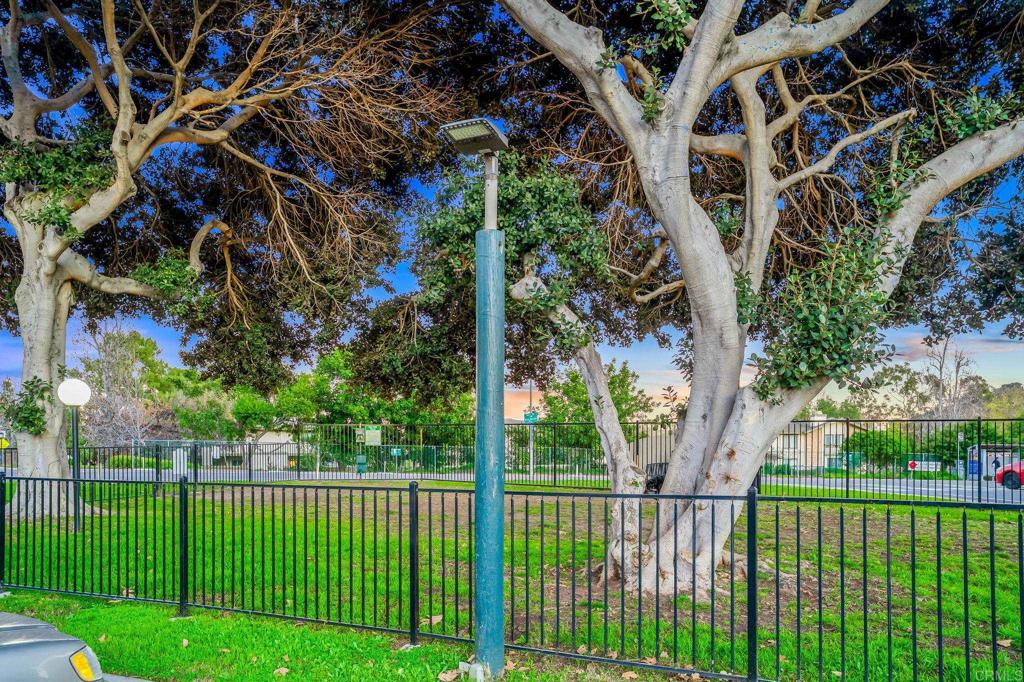 5922 Rancho Mission Road, Unit 78 San Diego, CA 92108 - Photo 25 of 25 a view of a house with a small yard