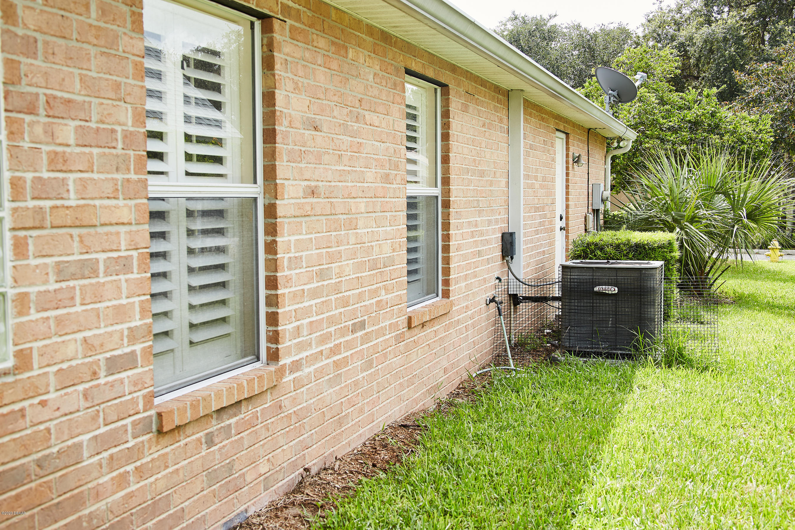 1 Reflections Village Drive Ormond Beach, FL 32174 - Photo 31 of 32 AC and Side of house