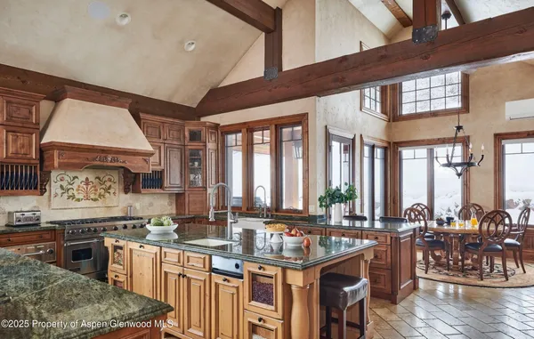 a kitchen with lots of counter top space and wooden floor