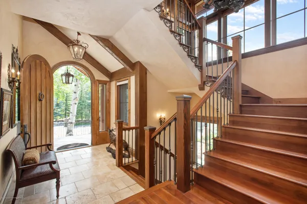 a view of staircase with two black white walls